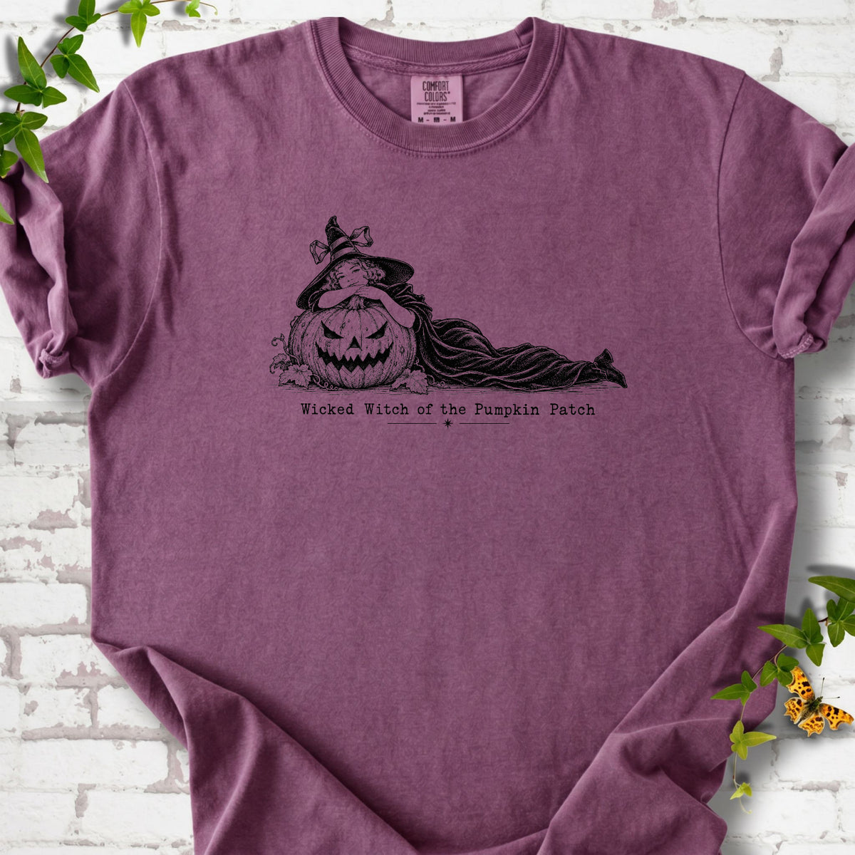 Wicked Witch of the Pumpkin Patch Halloween T-shirt in Berry with witch and jack-o'-lantern graphic