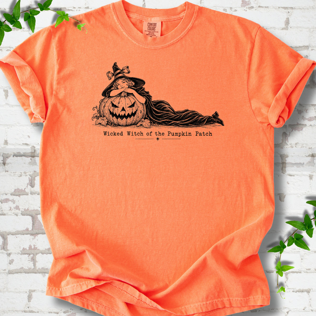 Wicked Witch of the Pumpkin Patch Halloween T-shirt in Melon with witch and jack-o'-lantern graphic