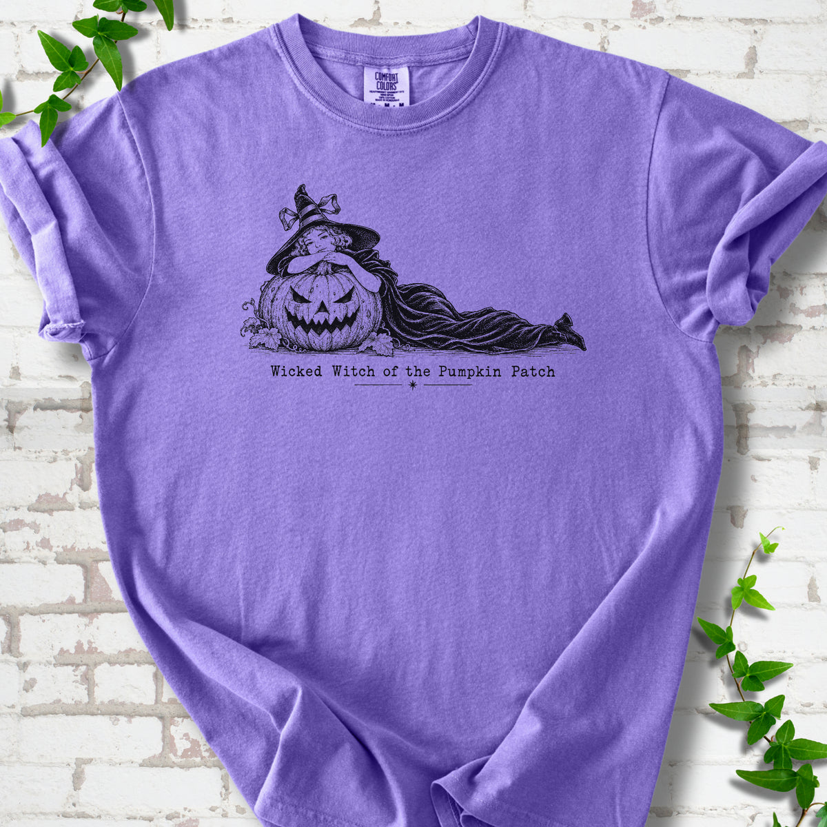 Wicked Witch of the Pumpkin Patch Halloween T-shirt in Violet with witch and jack-o'-lantern graphic