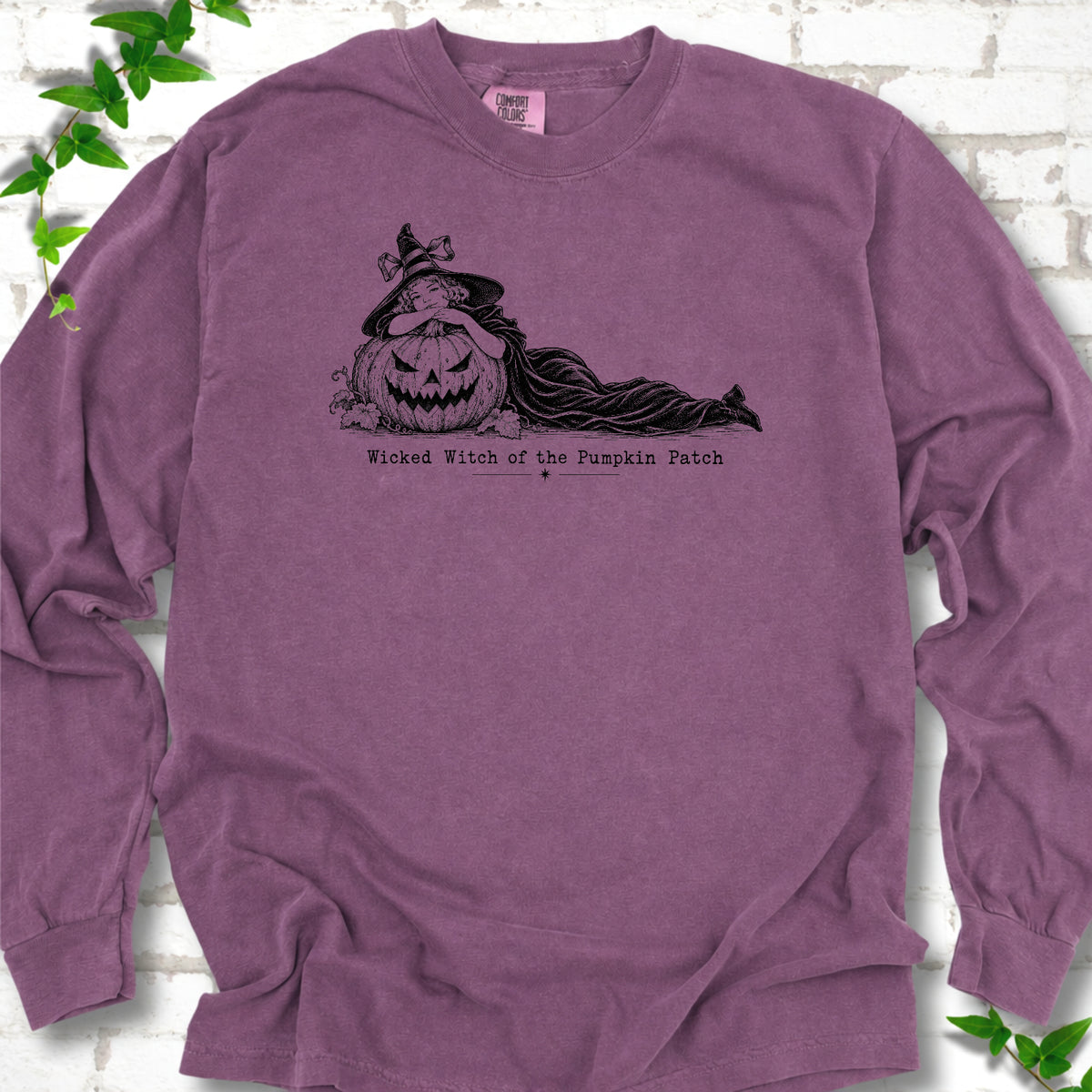 Wicked Witch of the Pumpkin Patch long sleeve witch shirt in Berry with witch and jack-o'-lantern graphic