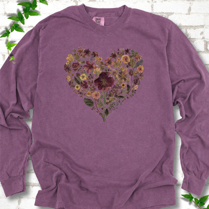 Berry Comfort Colors® long sleeve T-shirt flat lay featuring a heart formed from delicate wildflowers.