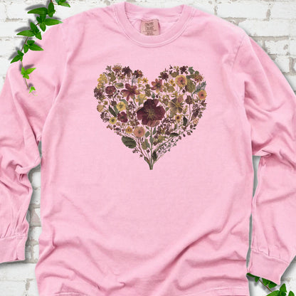 Blossom Comfort Colors® long sleeve T-shirt flat lay featuring a heart formed from delicate wildflowers.