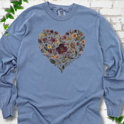 Blue Jean Comfort Colors® long sleeve T-shirt flat lay featuring a heart formed from delicate wildflowers.