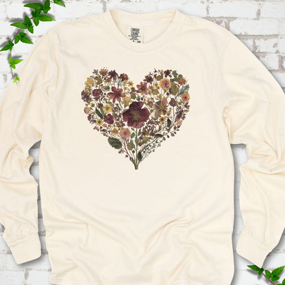 Ivory Comfort Colors® long sleeve T-shirt flat lay featuring a heart formed from delicate wildflowers.