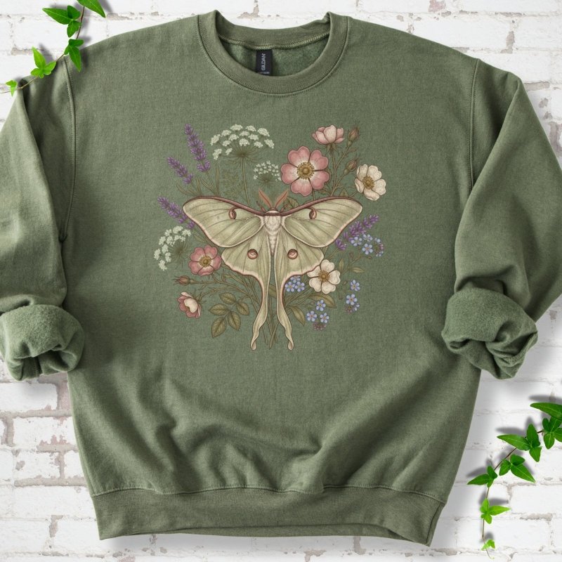 Military Green Gildan® 18000 crewneck sweatshirt flat lay featuring a pale luna moth surrounded by pink, lavender, blue and white wildflowers.