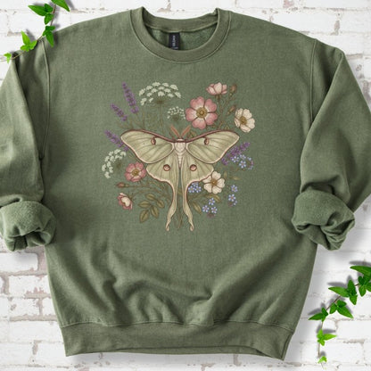 Military Green Gildan® 18000 crewneck sweatshirt flat lay featuring a pale luna moth surrounded by pink, lavender, blue and white wildflowers.