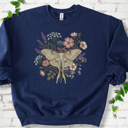 Navy Gildan® 18000 crewneck sweatshirt flat lay featuring a pale luna moth surrounded by pink, lavender, blue and white wildflowers.