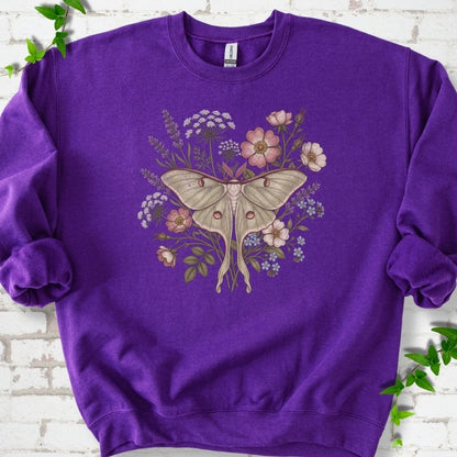 Purple Gildan® 18000 crewneck sweatshirt flat lay featuring a pale luna moth surrounded by pink, lavender, blue and white wildflowers.