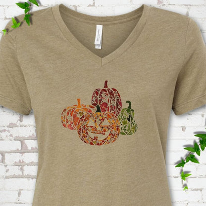 Heather Olive Bella Canvas® ladies' V-neck T-shirt flat lay featuring four pumpkins filled with colorful autumn leaves, ferns and wildflowers, including one smiling jack-o'-lantern.