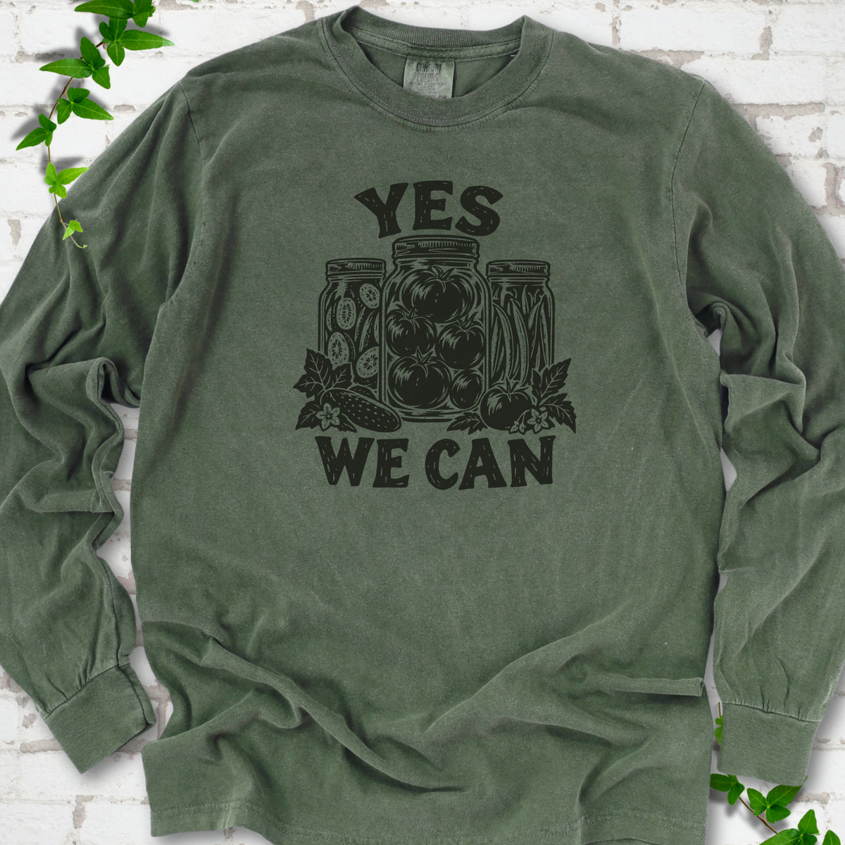 Hemp Comfort Colors® long sleeve T-shirt flat lay featuring preserved tomatoes in jars and the words “Yes We Can.”