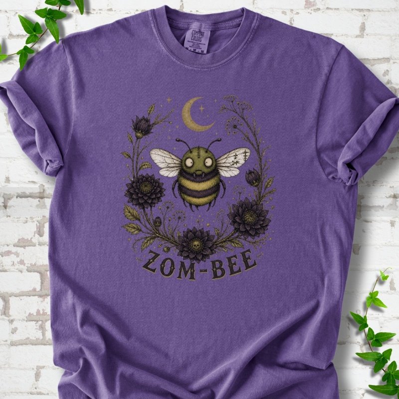 Grape Zom-Bee Gothic Garden Comfort Colors® T-shirt with a zombie bee, crescent moon and dark flowers