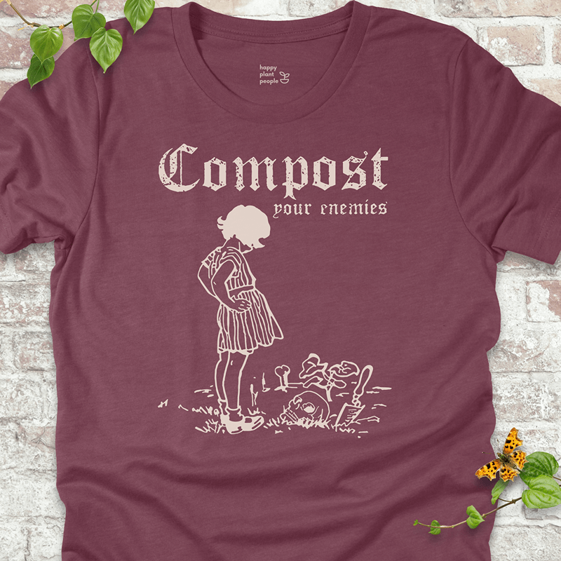 Spooky garden humor tee in maroon with skull and compost tools
