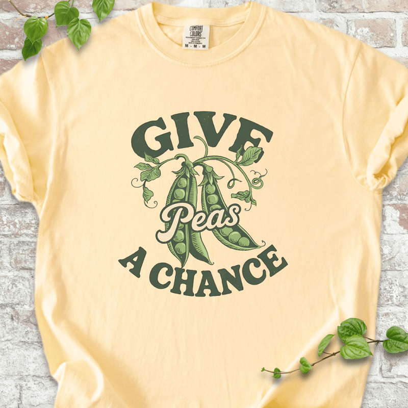 Funny gardening T-shirt with “Give Peas a Chance” design, printed on Comfort Colors™ Banana shirt