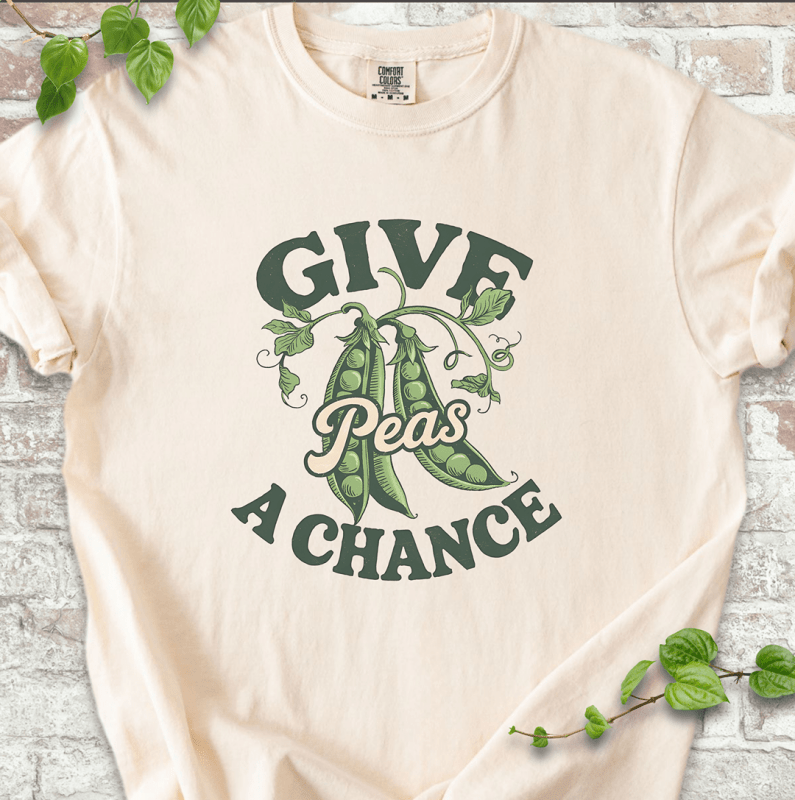 Funny gardening T-shirt with “Give Peas a Chance” design, printed on Comfort Colors ivory shirt