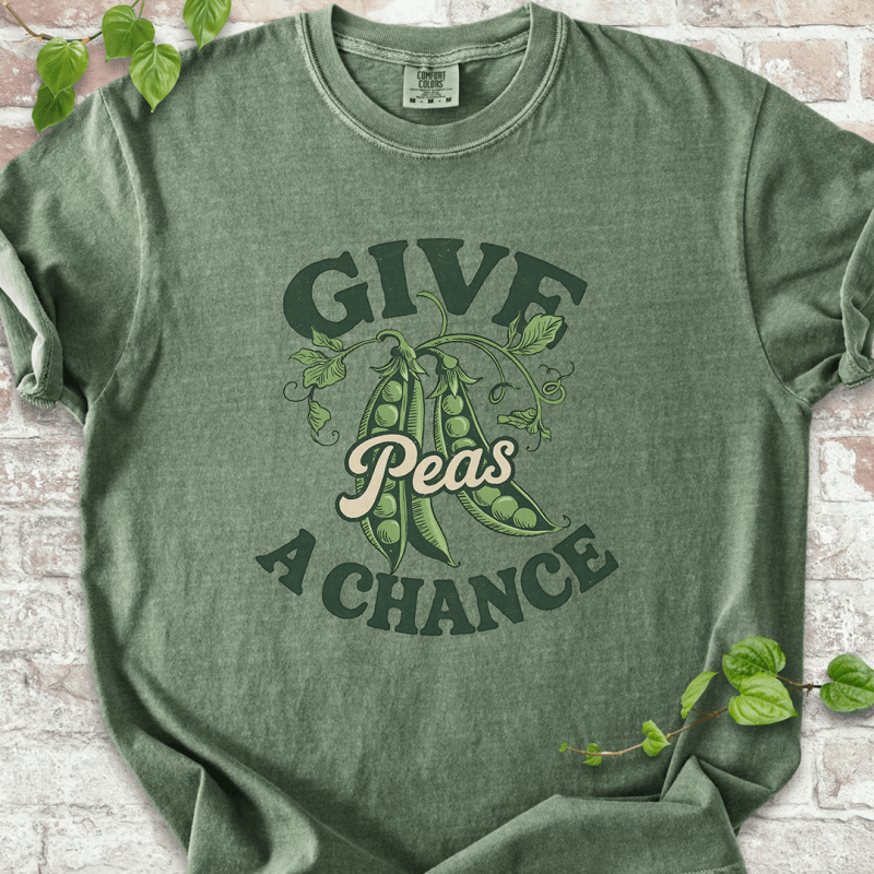 Funny gardening T-shirt with “Give Peas a Chance” design, printed on Comfort Colors™ moss shirt