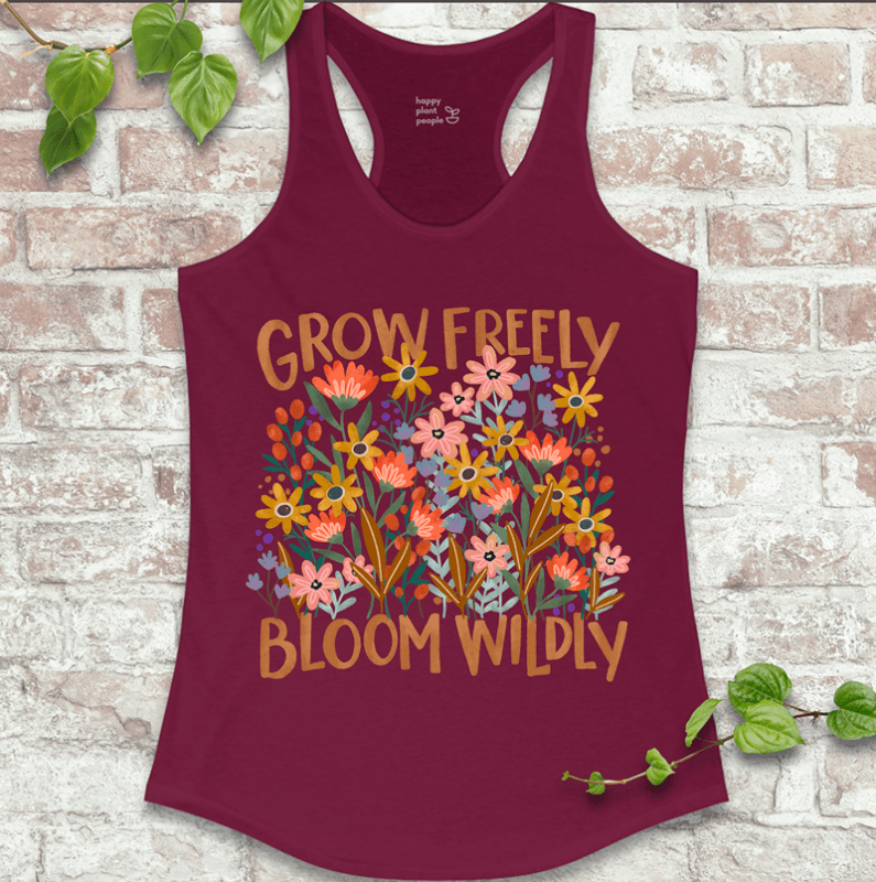 Wild garden-themed racerback with colorful blooms and positive message on red