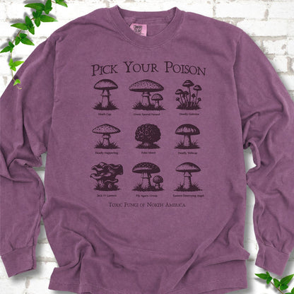 Berry Comfort Colors® long sleeve T-shirt flat lay featuring a Pick Your Poison field guide of toxic North American mushrooms.