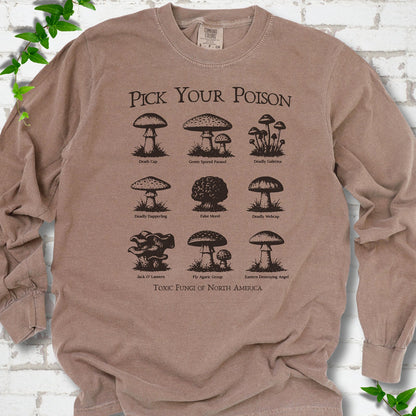 Espresso Comfort Colors® long sleeve T-shirt flat lay featuring a Pick Your Poison field guide of toxic North American mushrooms.