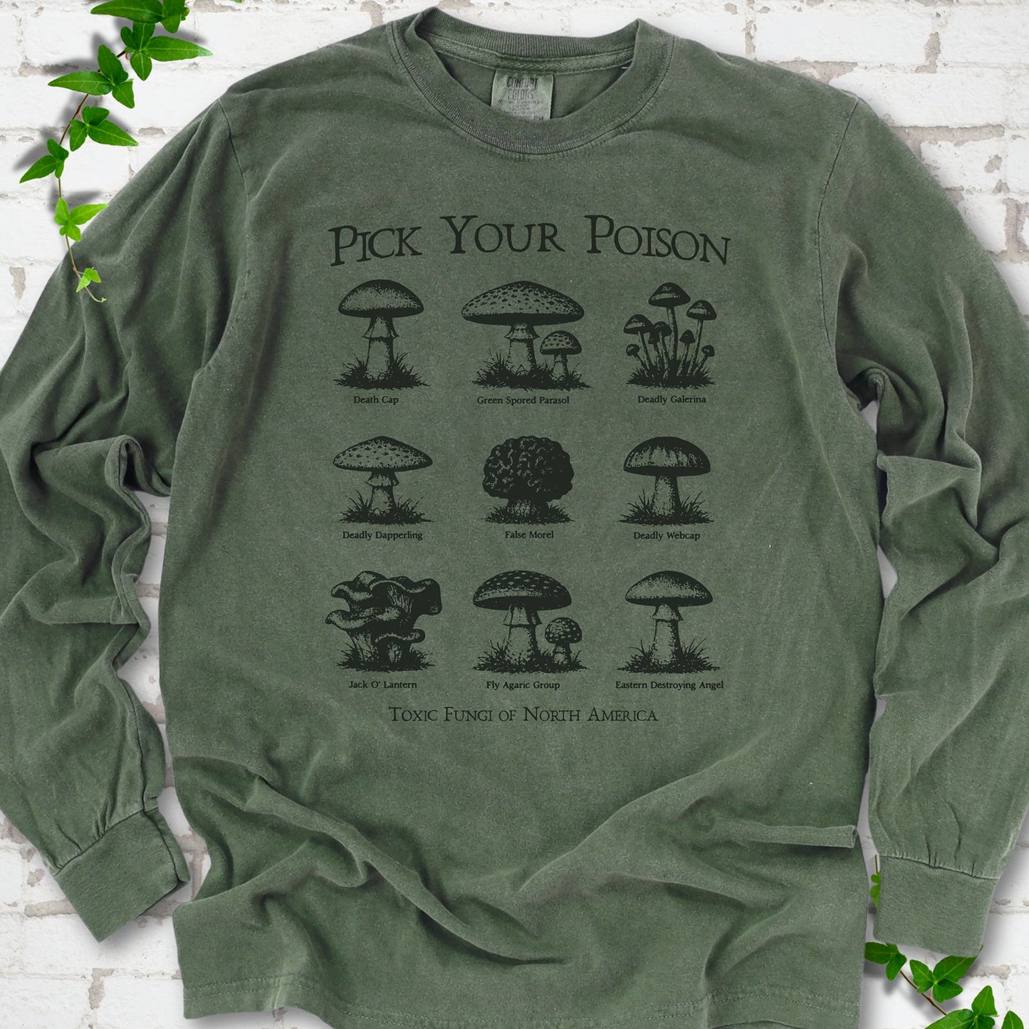 Hemp Comfort Colors® long sleeve T-shirt flat lay featuring a Pick Your Poison field guide of toxic North American mushrooms.