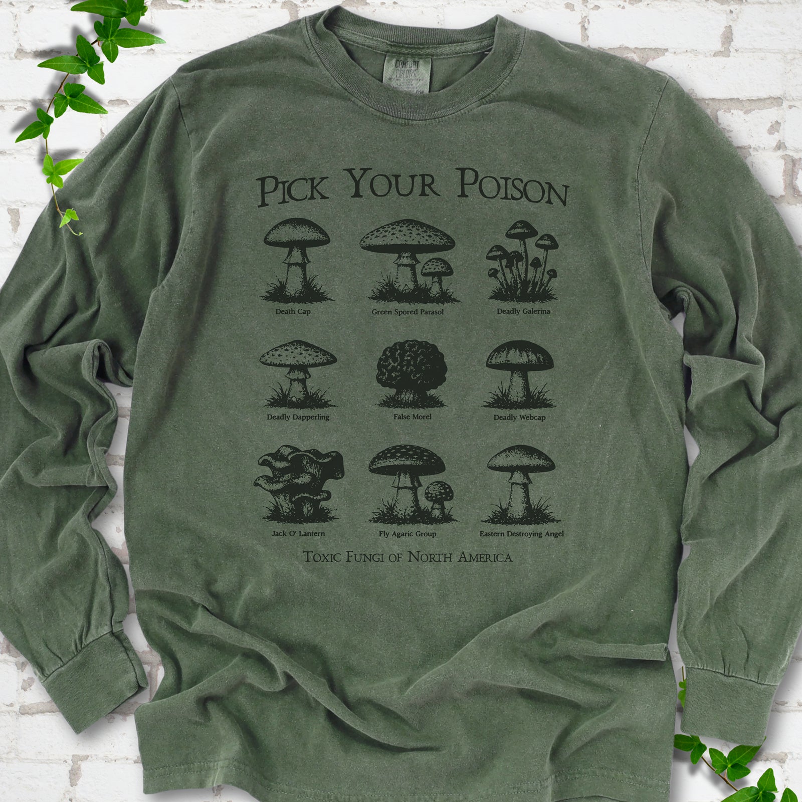 Hemp Comfort Colors® long sleeve T-shirt flat lay featuring a Pick Your Poison field guide of toxic North American mushrooms.