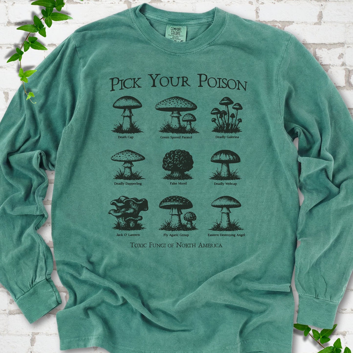 Light Green Comfort Colors® long sleeve T-shirt flat lay featuring a Pick Your Poison field guide of toxic North American mushrooms.
