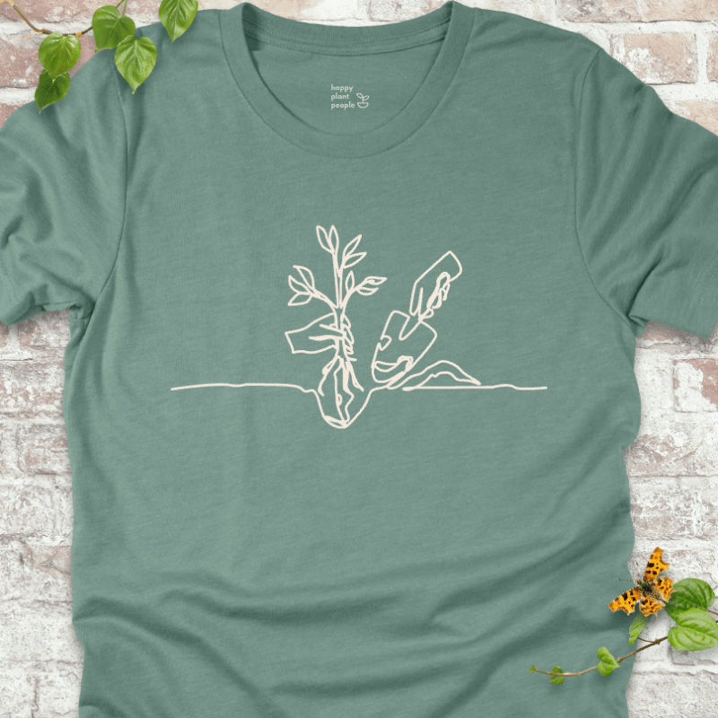 Minimalist planting illustration on a dusty blue T-shirt
