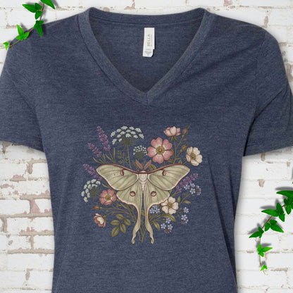 Heather Navy Bella Canvas® V-neck T-shirt flat lay featuring a pale luna moth surrounded by pink, lavender, blue and white wildflowers.