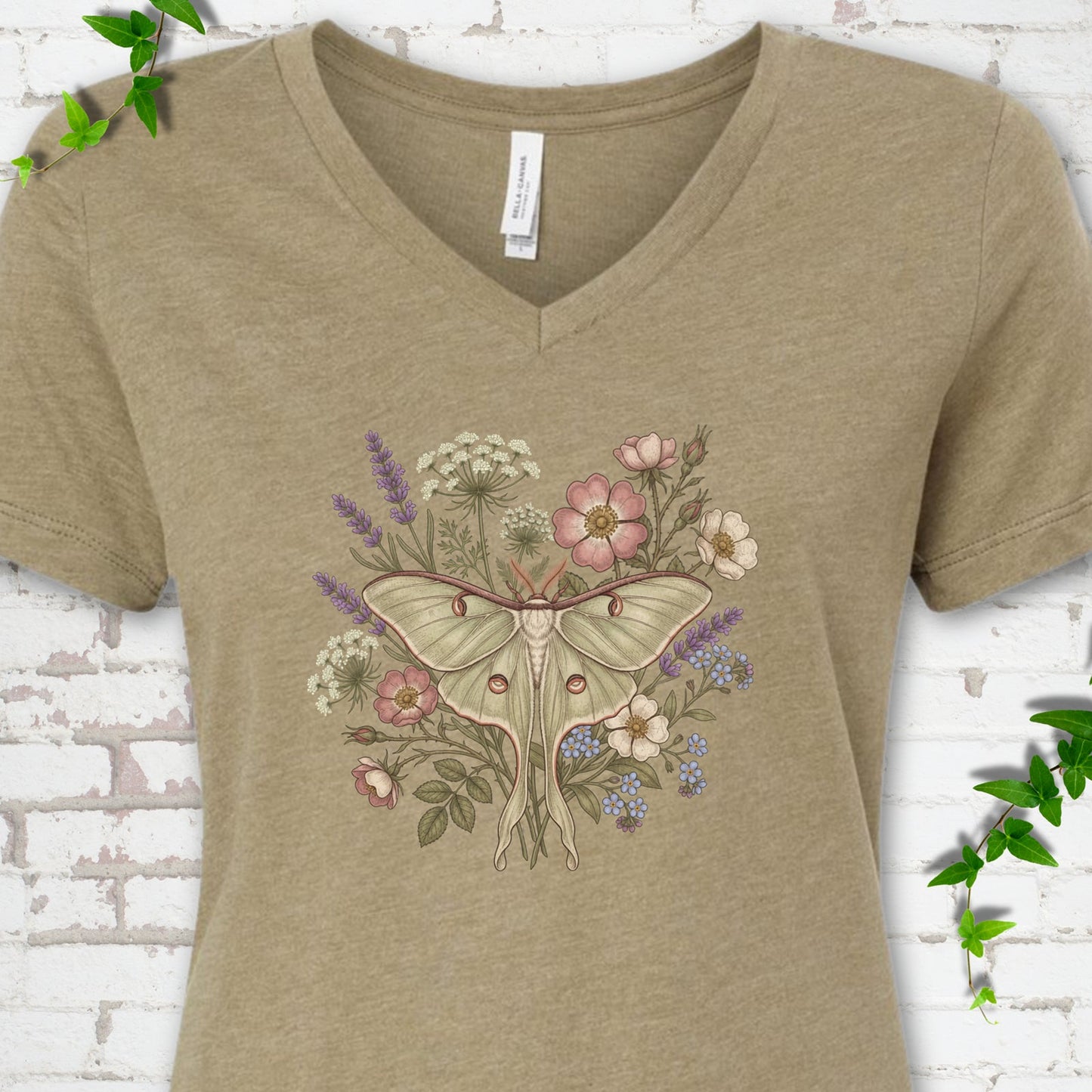 Heather Olive Bella Canvas® V-neck T-shirt flat lay featuring a pale luna moth surrounded by pink, lavender, blue and white wildflowers.