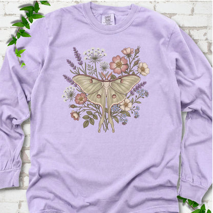 Orchid Comfort Colors® long sleeve T-shirt flat lay featuring a pale luna moth surrounded by pink, lavender, blue and white wildflowers.